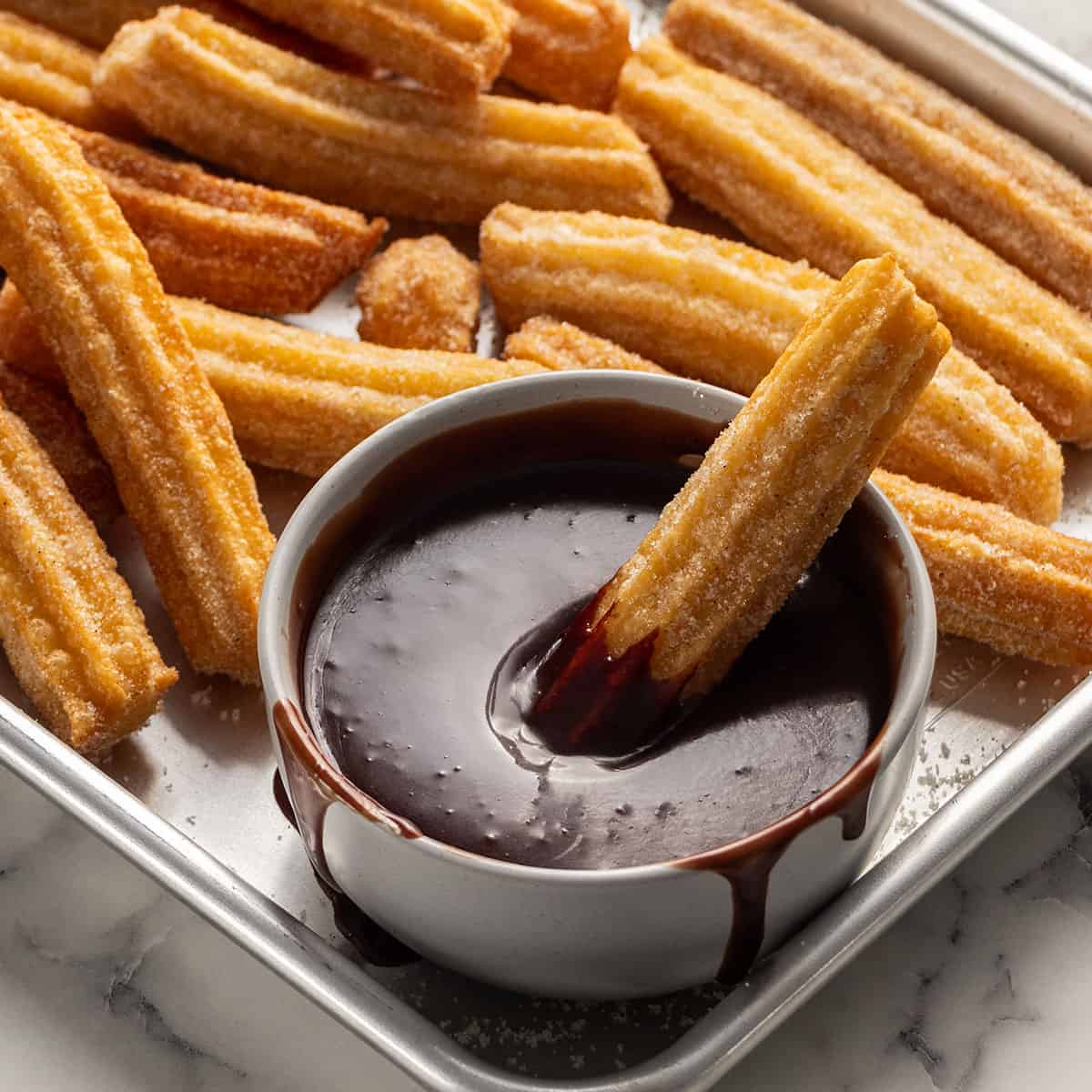 Traditional Spanish desserts like churros, crema catalana, and tarta de Santiago