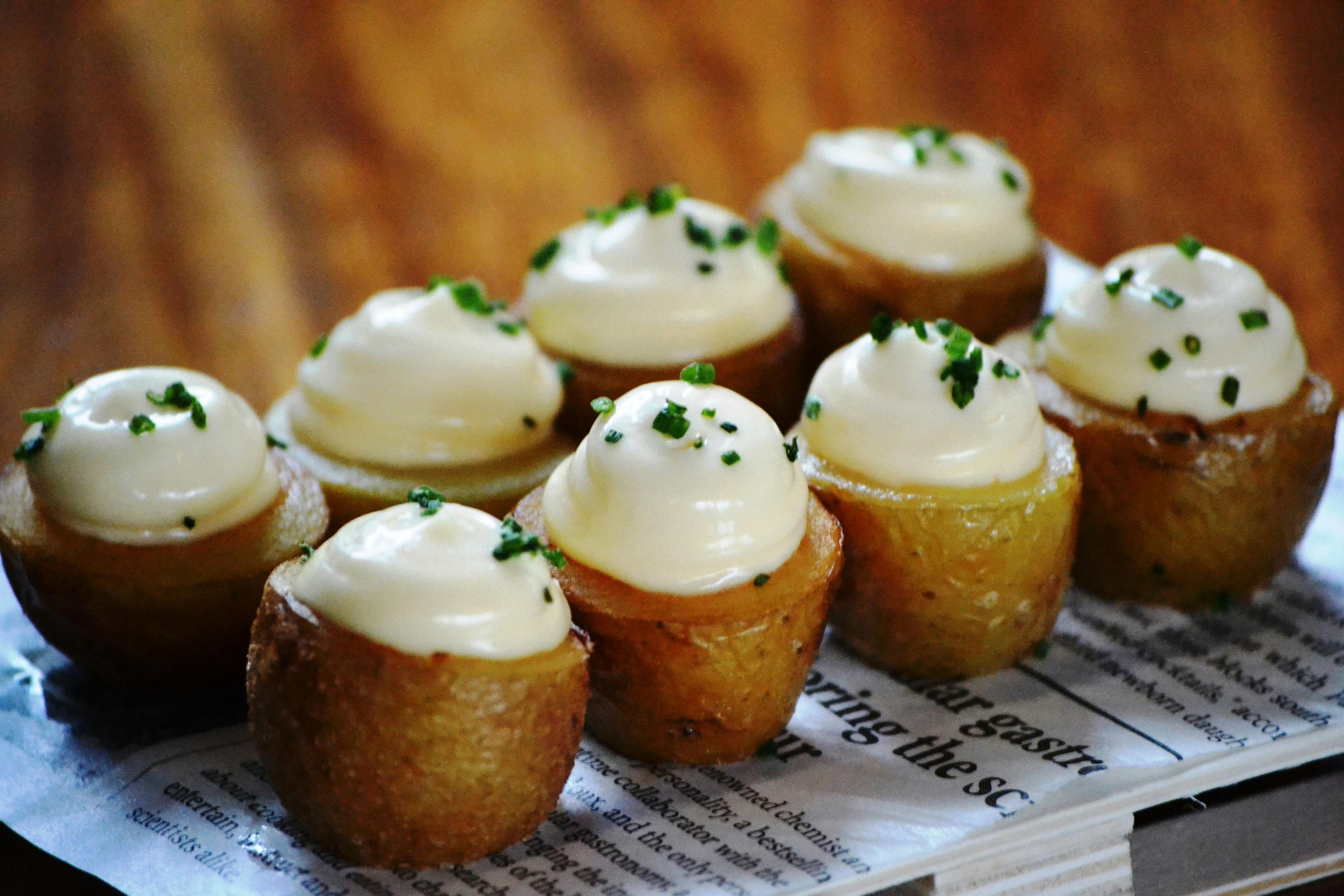 Spanish tapas with aioli and chives on bread served in traditional style