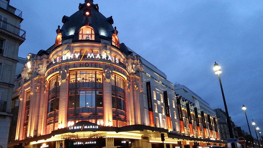Le BHV Marais at dusk with vibrant street scene