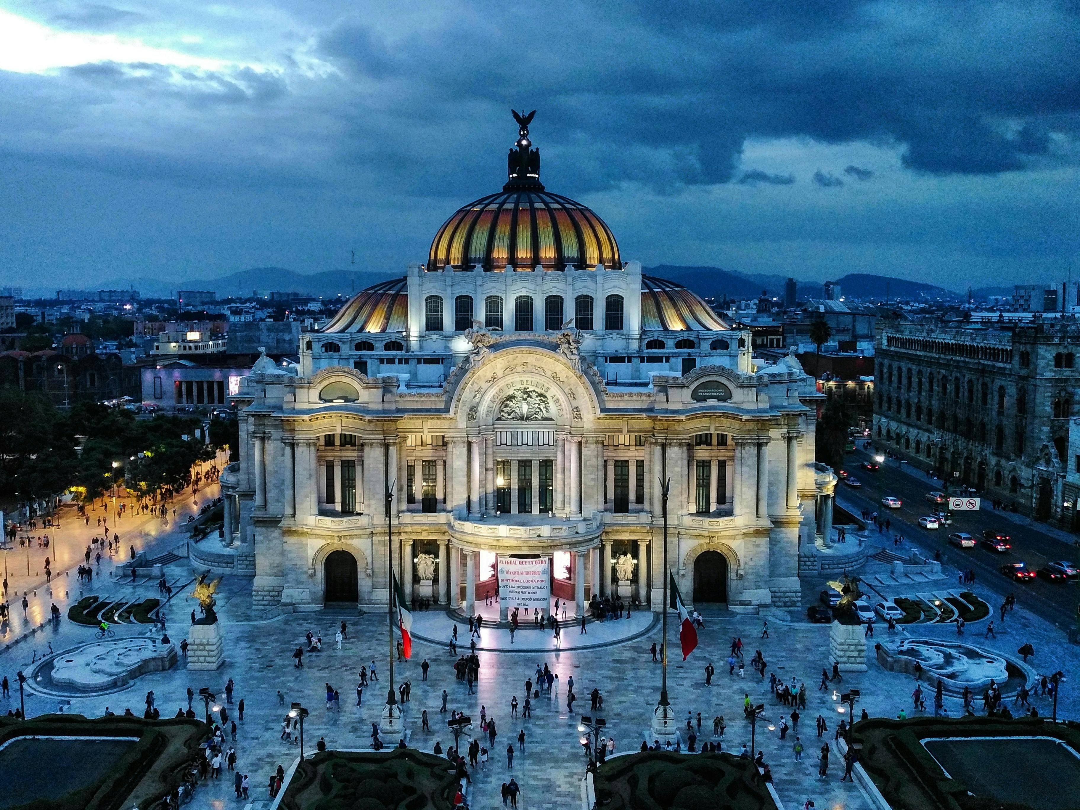 Palacio de Bellas Artes illuminated in Mexico City at dusk